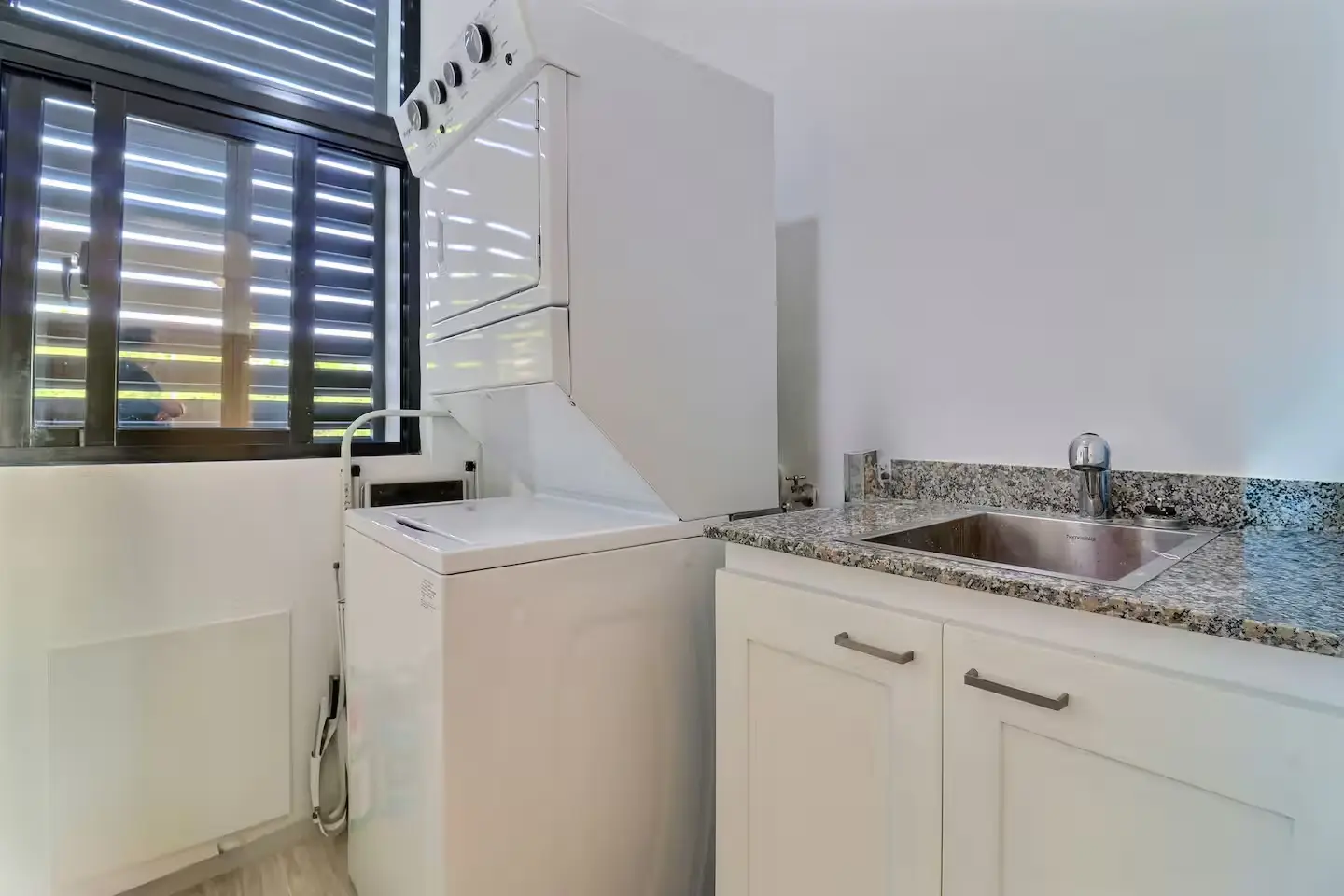 In-unit laundry with full-size washer, dryer, and utility sink