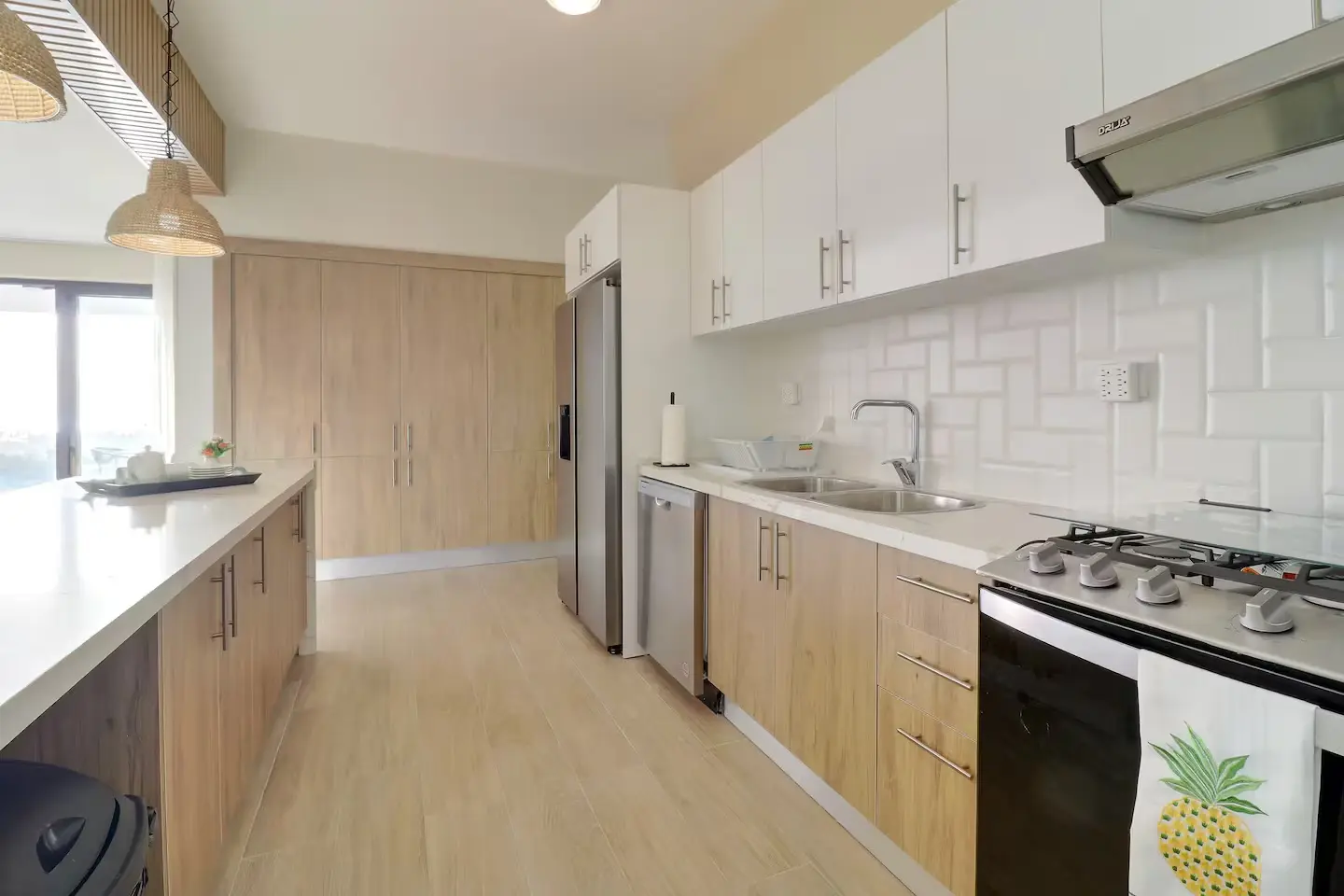 Galley kitchen with full-size range, dishwasher, and side-by-side refrigerator