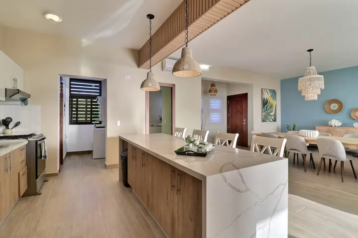 Open-concept kitchen with marble-topped island